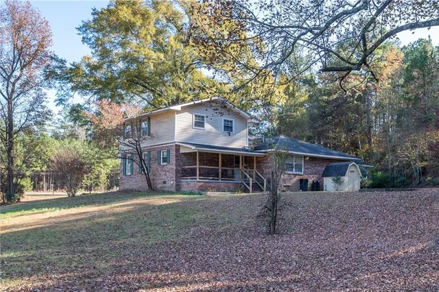 a view of a tree in front of a house