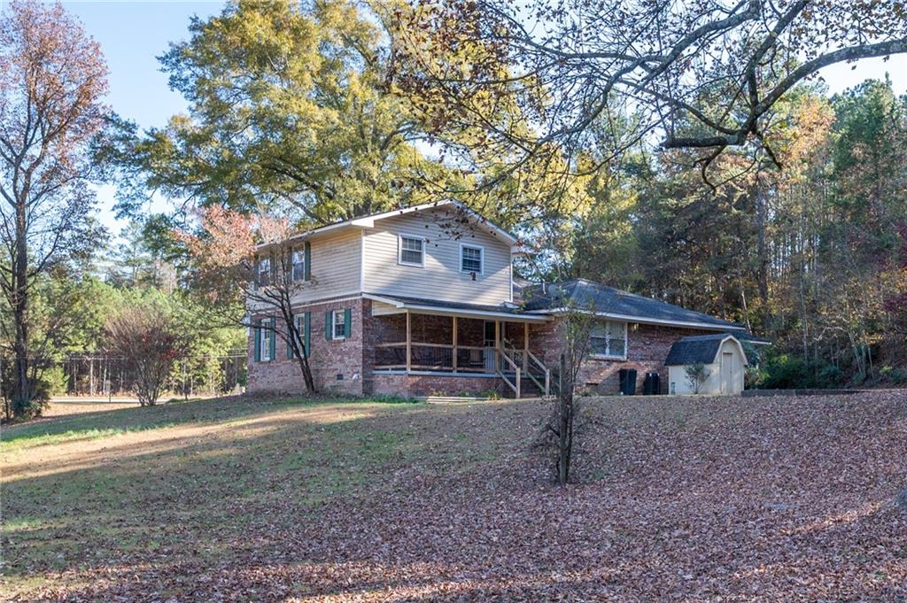 3293 Rome Road Southwest Plainville, GA 30733 - Photo 39 of 42 front view of a house with a yard