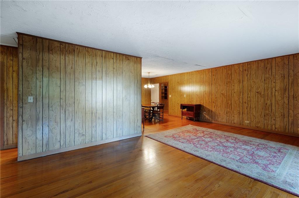 3293 Rome Road Southwest Plainville, GA 30733 - Photo 6 of 42 a view of a room with wooden floor