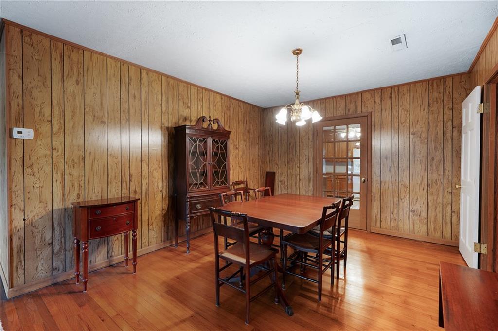 3293 Rome Road Southwest Plainville, GA 30733 - Photo 10 of 42 a dining room with furniture window and wooden floor