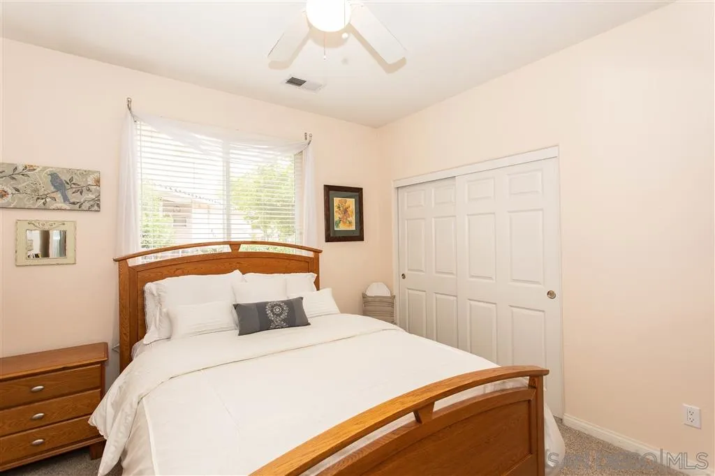 805 La Rue Avenue Fallbrook, CA 92028 - Photo 15 of 25 a bedroom with a bed and a window