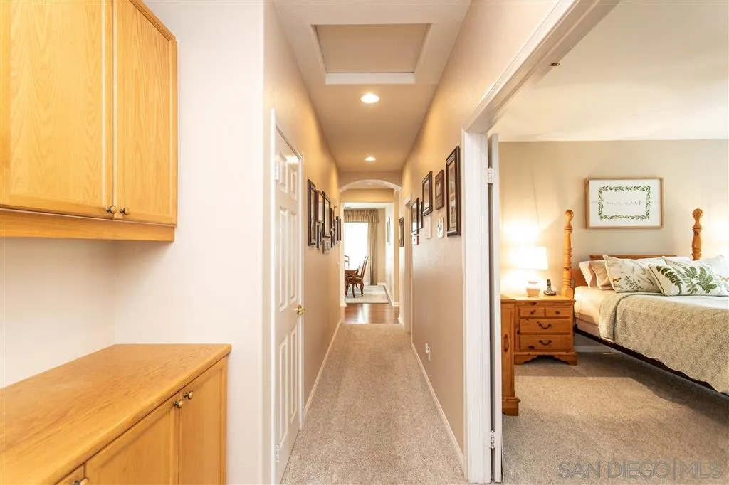 805 La Rue Avenue Fallbrook, CA 92028 - Photo 16 of 25 a view of a bedroom with bed and hallway
