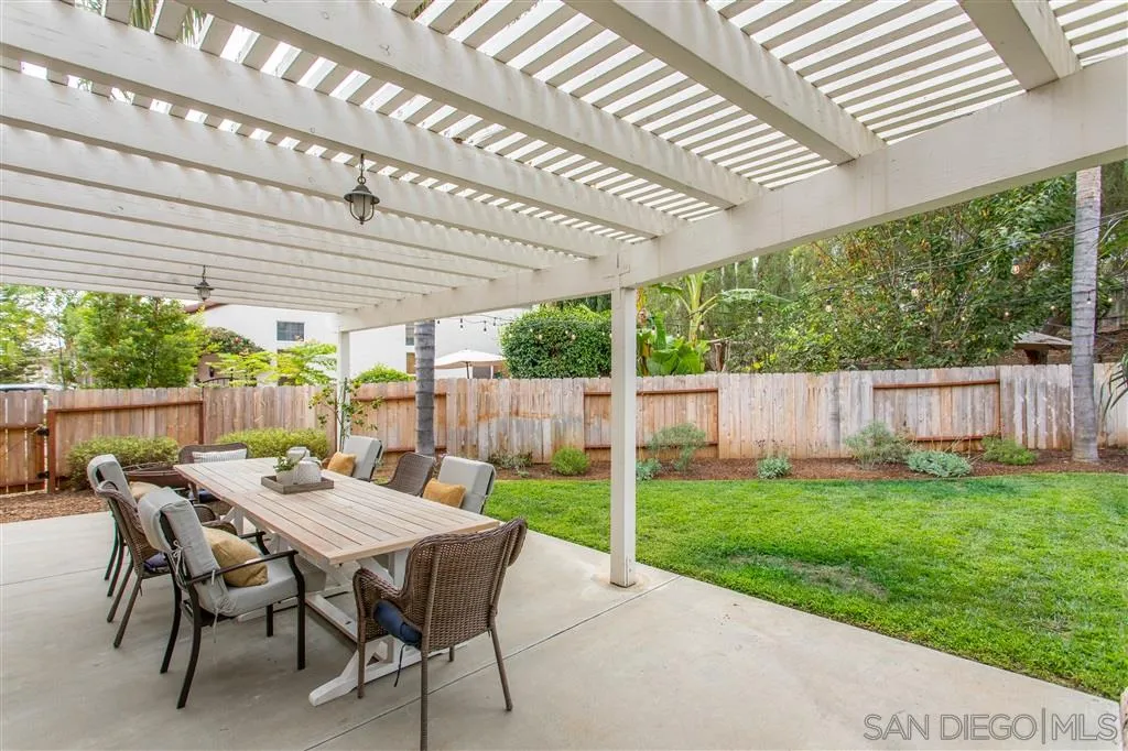 805 La Rue Avenue Fallbrook, CA 92028 - Photo 17 of 25 a view of a patio with a table chairs and a backyard
