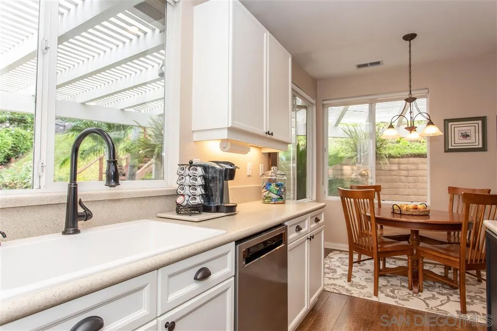 805 La Rue Avenue Fallbrook, CA 92028 - Photo 4 of 25 a kitchen with a table chairs and a window