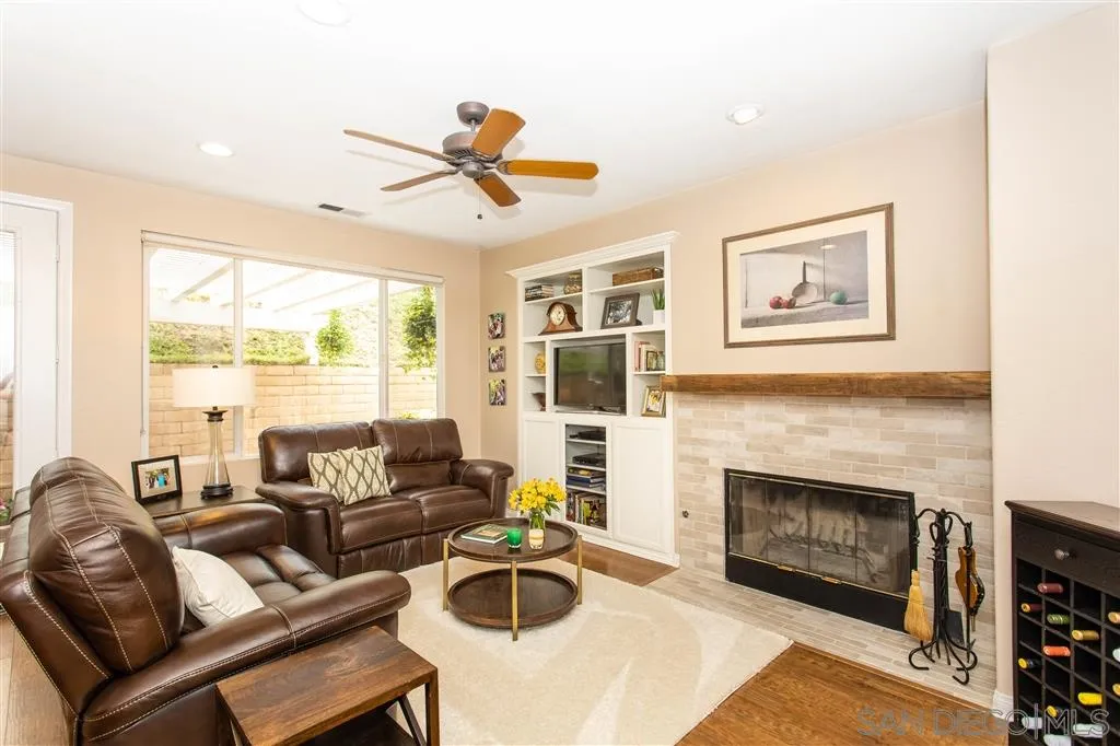 805 La Rue Avenue Fallbrook, CA 92028 - Photo 6 of 25 a living room with furniture and a fireplace