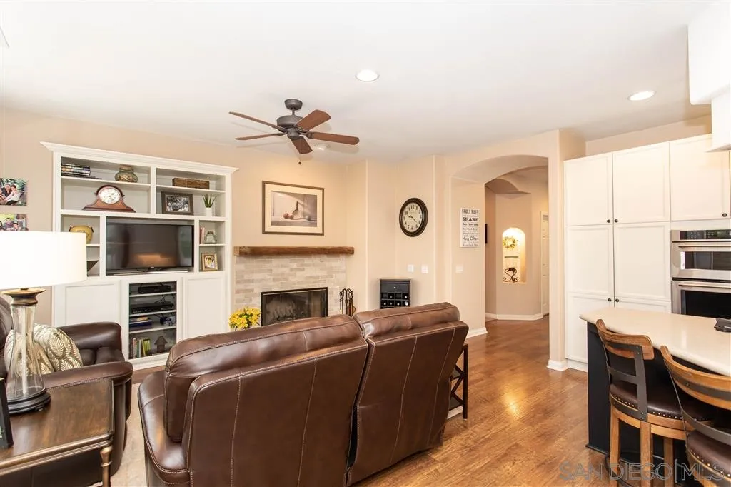 805 La Rue Avenue Fallbrook, CA 92028 - Photo 7 of 25 a living room with furniture a flat screen tv and kitchen view