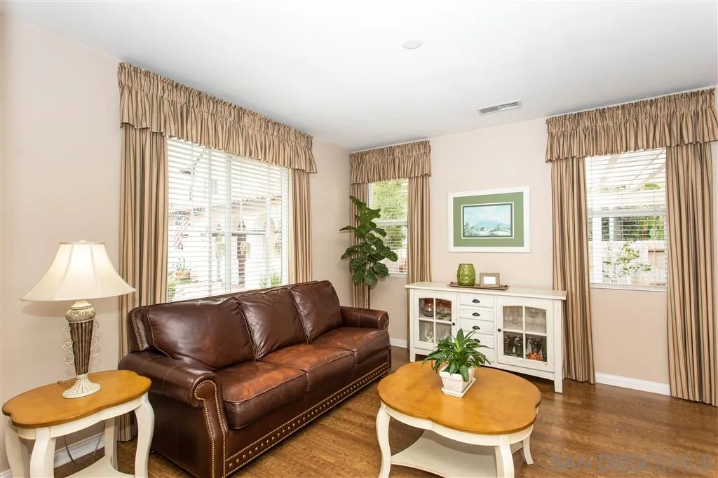 805 La Rue Avenue Fallbrook, CA 92028 - Photo 8 of 25 a living room with furniture a table and a window