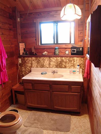 6310 Starr Road Windsor, CA 95492 - Photo 7 of 12 a bathroom with a sink a toilet and a large mirror
