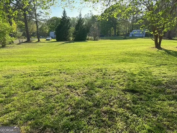 a view of swimming pool with a yard