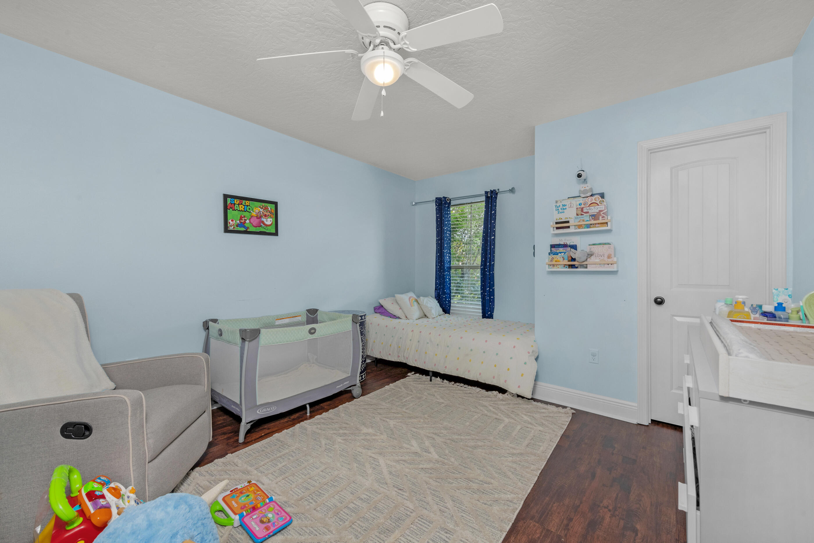 4509 Beth Circle Crestview, FL 32539 - Photo 14 of 29 a bed room with a bed and furniture