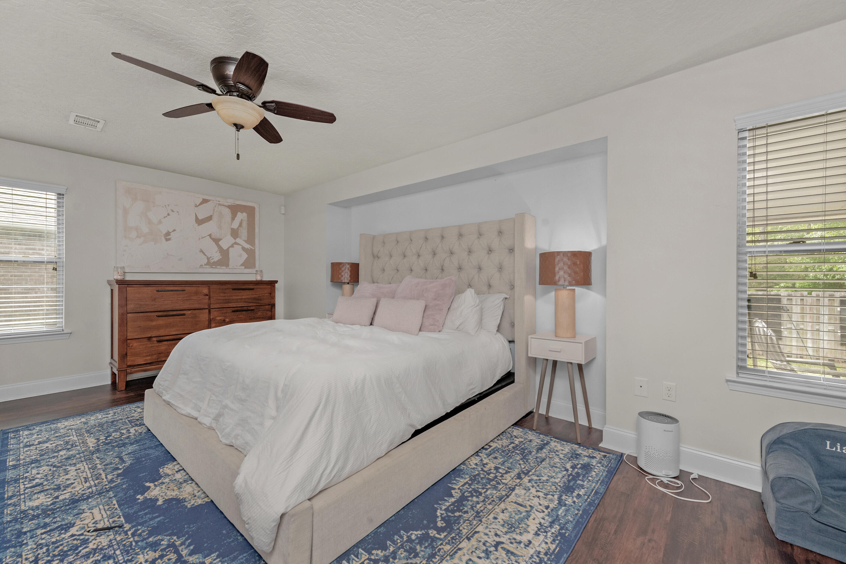 4509 Beth Circle Crestview, FL 32539 - Photo 17 of 29 a bed room with a bed and a chandelier