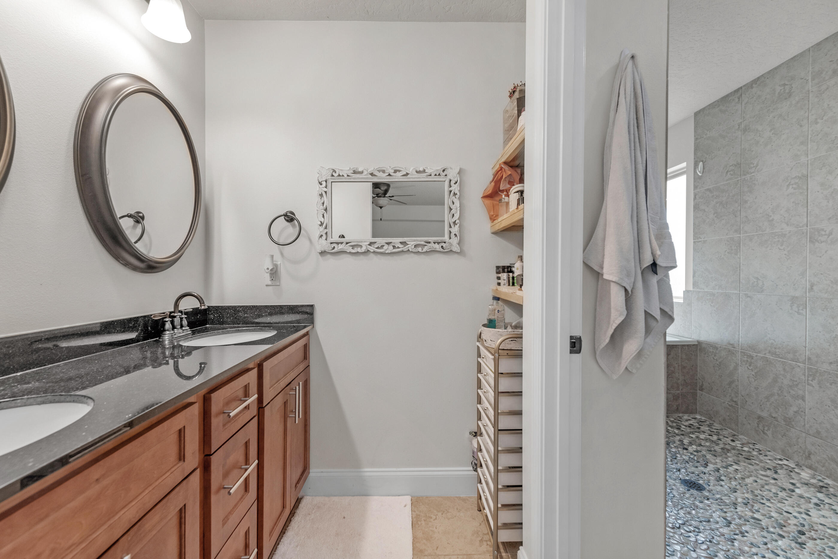4509 Beth Circle Crestview, FL 32539 - Photo 19 of 29 a bathroom with a sink and a mirror