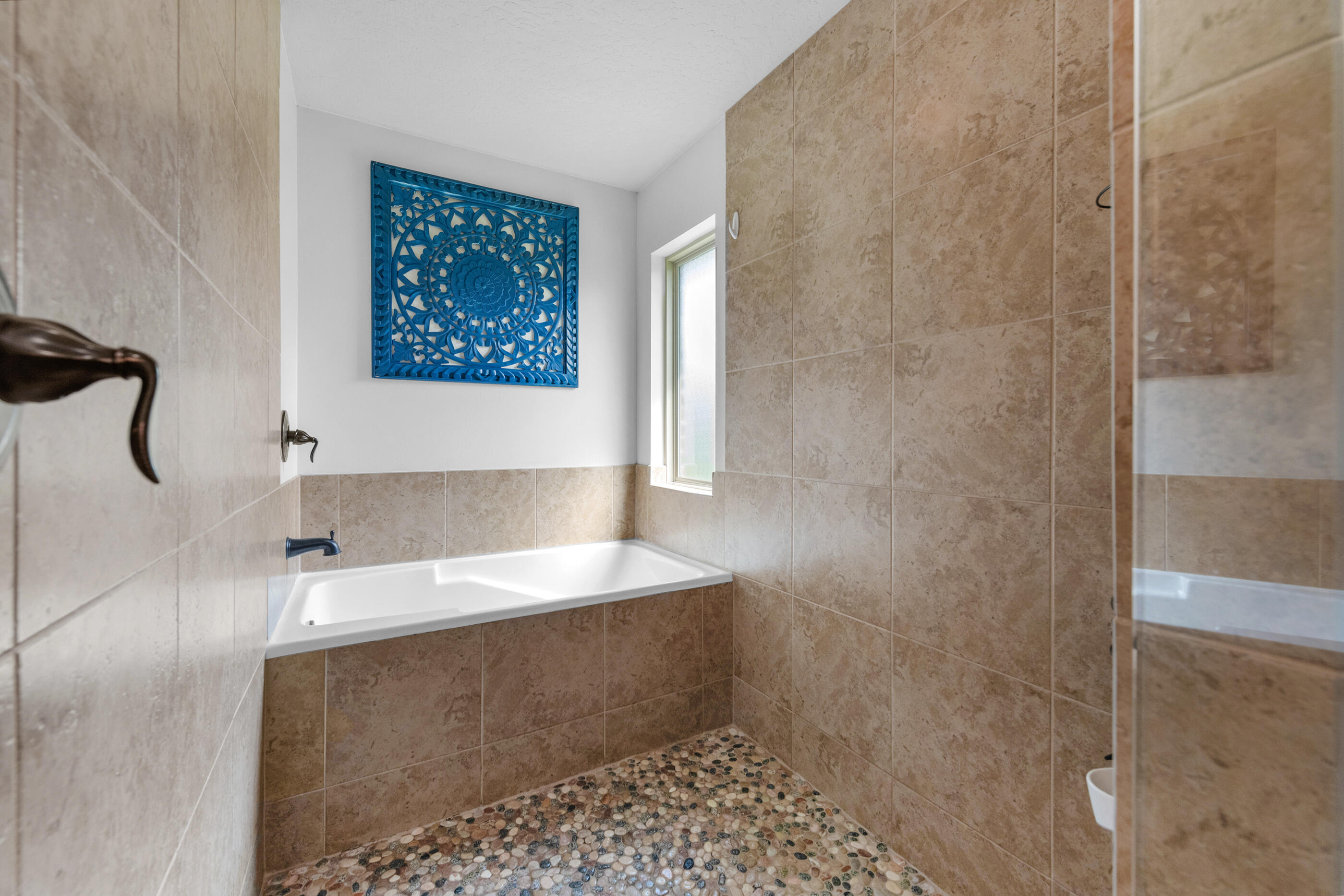 4509 Beth Circle Crestview, FL 32539 - Photo 21 of 29 a bathroom with a bathtub and a shower