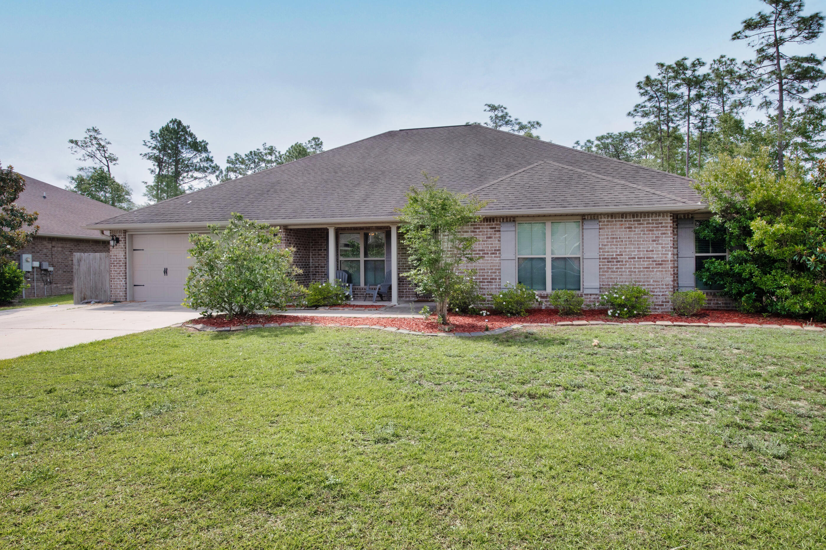 4509 Beth Circle Crestview, FL 32539 - Photo 28 of 29 a front view of a house with a yard and garage