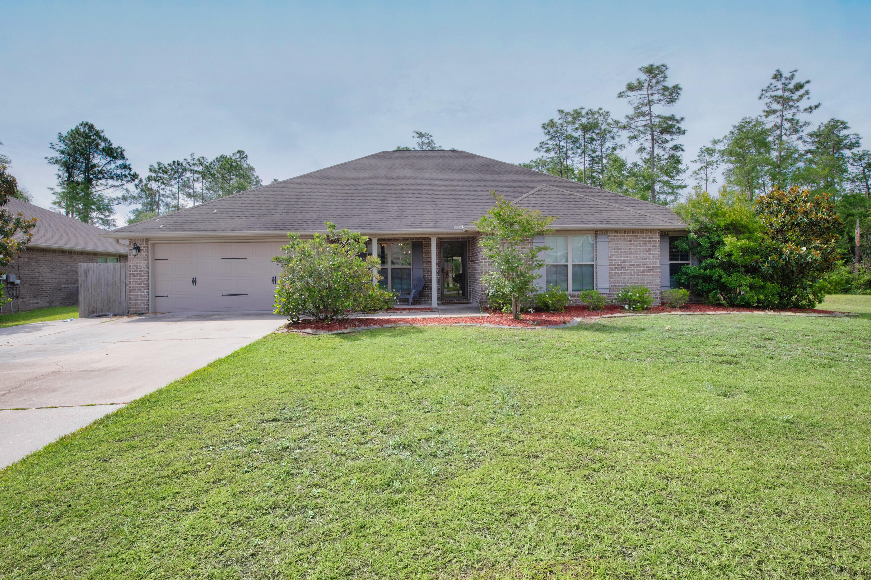 4509 Beth Circle Crestview, FL 32539 - Photo 29 of 29 a front view of a house with garden