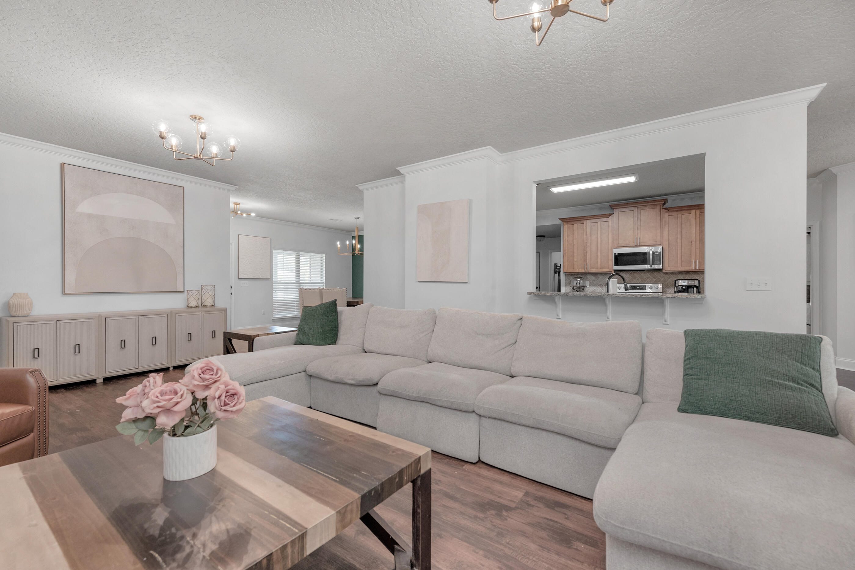 4509 Beth Circle Crestview, FL 32539 - Photo 8 of 29 a living room with furniture and a chandelier
