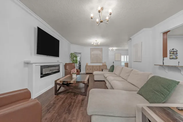 a living room with furniture fireplace and a flat screen tv