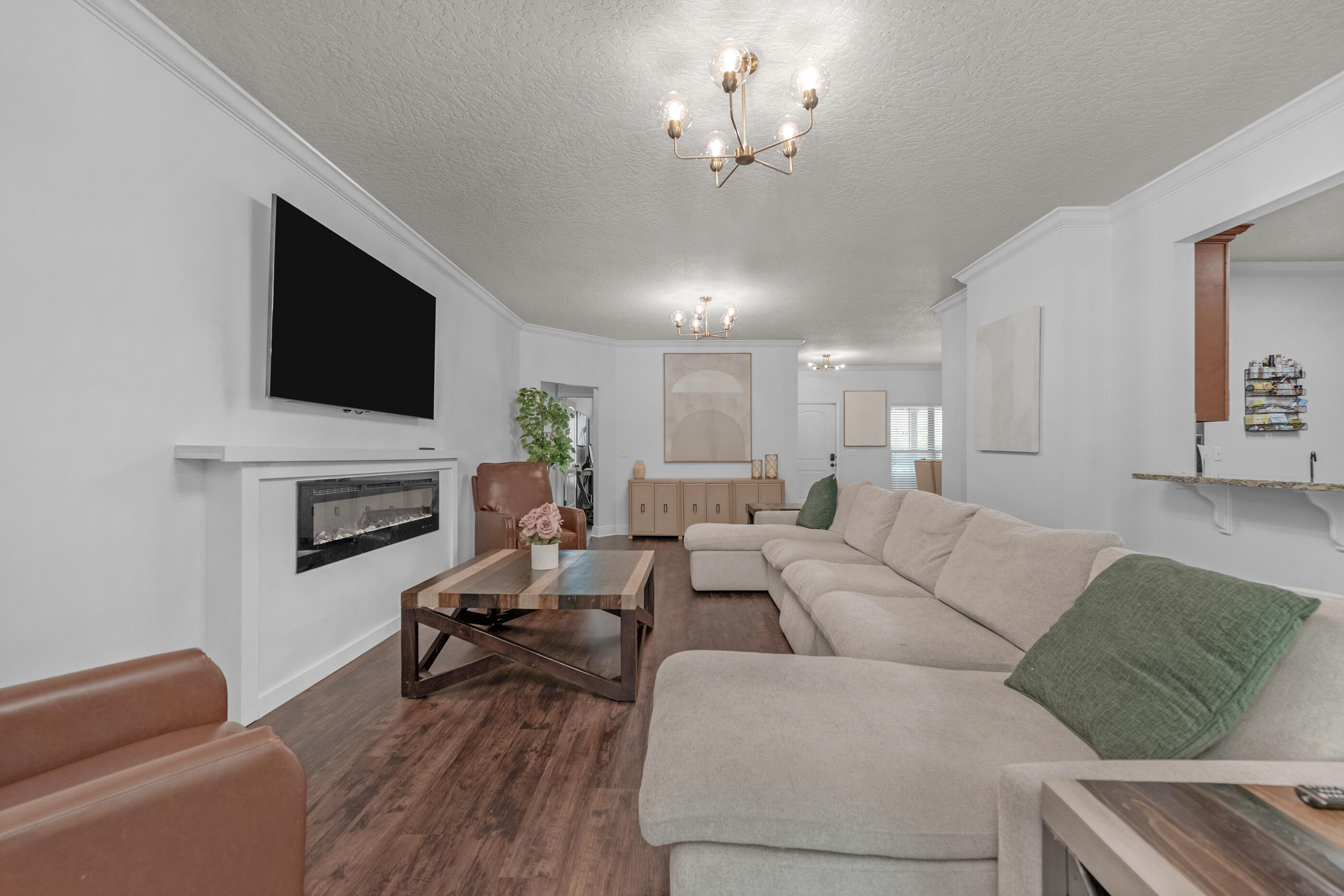 4509 Beth Circle Crestview, FL 32539 - Photo 9 of 29 a living room with furniture fireplace and a flat screen tv