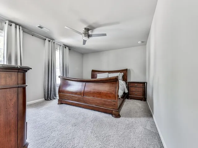 a bedroom with furniture and a window