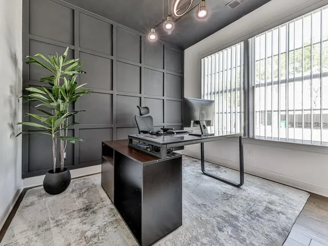 a kitchen with stainless steel appliances granite countertop a sink a stove and a refrigerator