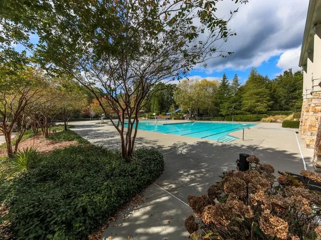 an aerial view of a fireplace with table and chairs