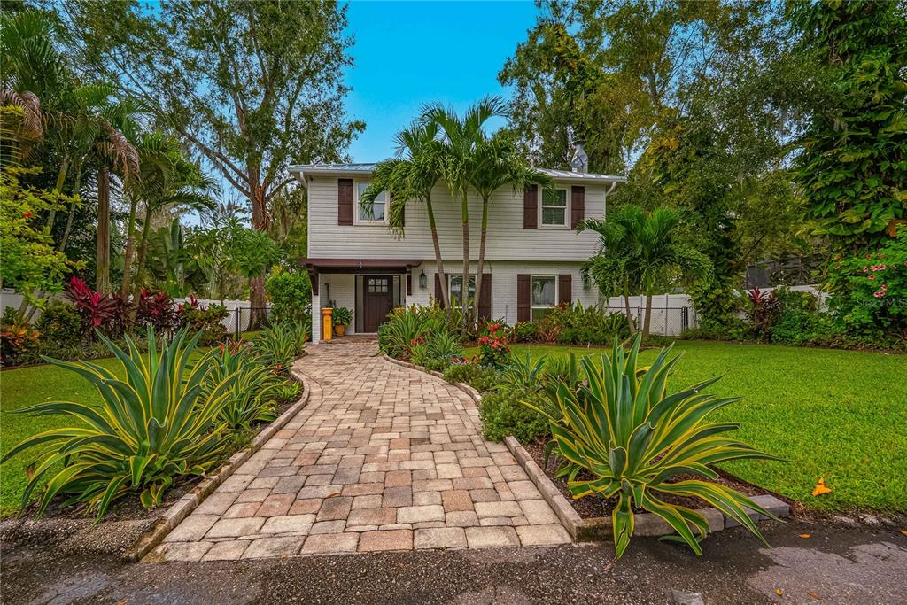 a front view of a house with garden