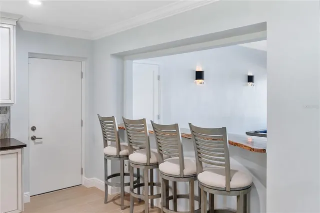 a living room with a flat screen tv and a large window