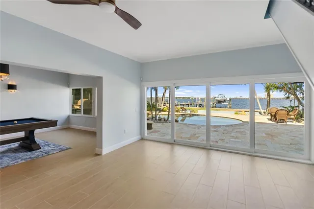 a spacious bathroom with a granite countertop tub sink a mirror and a shower