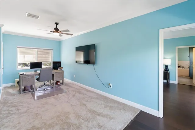 a view of a livingroom with furniture wooden floor and a chandelier