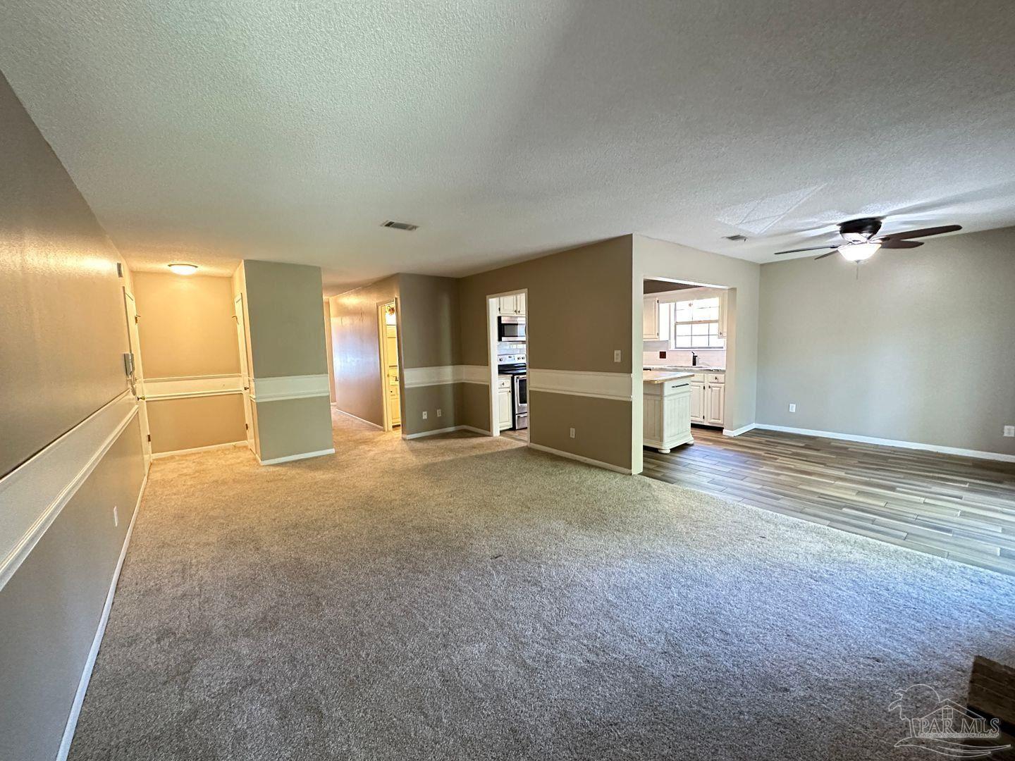 4831 East Olive Road, Unit 4D Pensacola, FL 32514 - Photo 3 of 17 a view of empty room with wooden floor