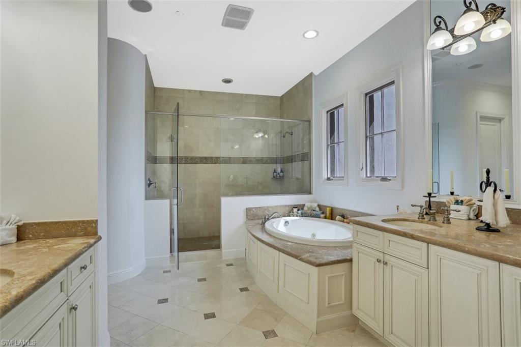 16649 Toscana Circle, Unit 806 Naples, FL 34110 - Photo 20 of 35 a bathroom with a sink a toilet and mirror