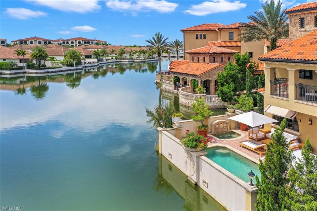 16649 Toscana Circle, Unit 806 Naples, FL 34110 - Photo 2 of 35 an aerial view of a house with lake view