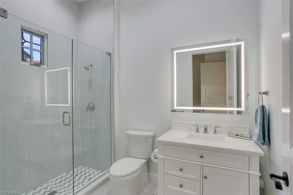 16649 Toscana Circle, Unit 806 Naples, FL 34110 - Photo 23 of 35 a bathroom with a sink a toilet and shower