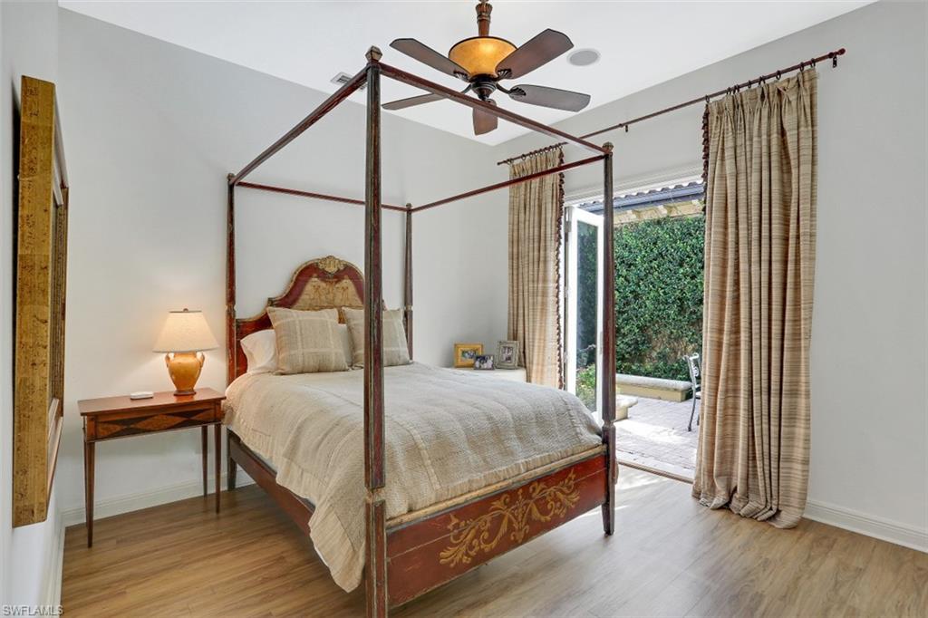 16649 Toscana Circle, Unit 806 Naples, FL 34110 - Photo 24 of 35 a bedroom with a bed and a window