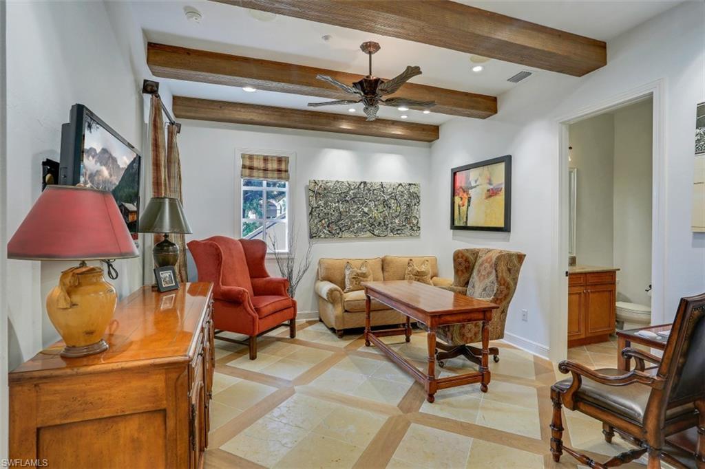 16649 Toscana Circle, Unit 806 Naples, FL 34110 - Photo 27 of 35 a living room with furniture and a window