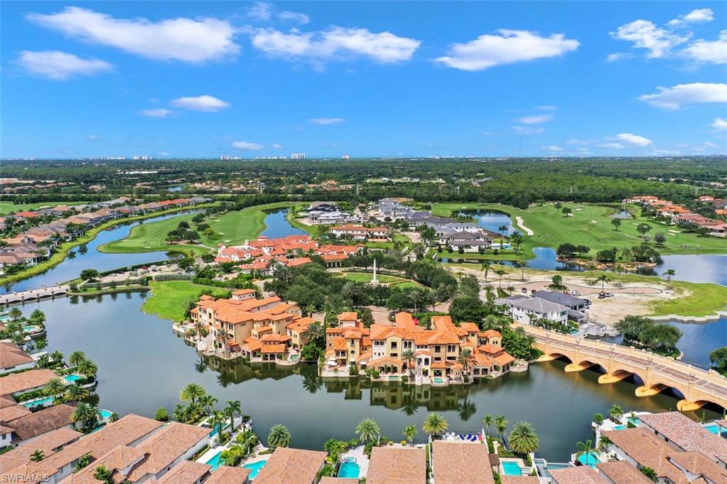 16649 Toscana Circle, Unit 806 Naples, FL 34110 - Photo 29 of 35 a view of a lake with a houses