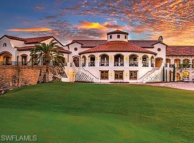 16649 Toscana Circle, Unit 806 Naples, FL 34110 - Photo 32 of 35 a front view of a house with a garden