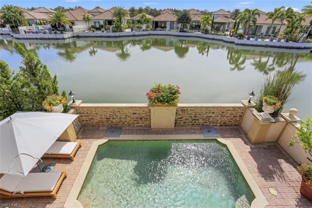 16649 Toscana Circle, Unit 806 Naples, FL 34110 - Photo 7 of 35 an aerial view of a house with a lake view