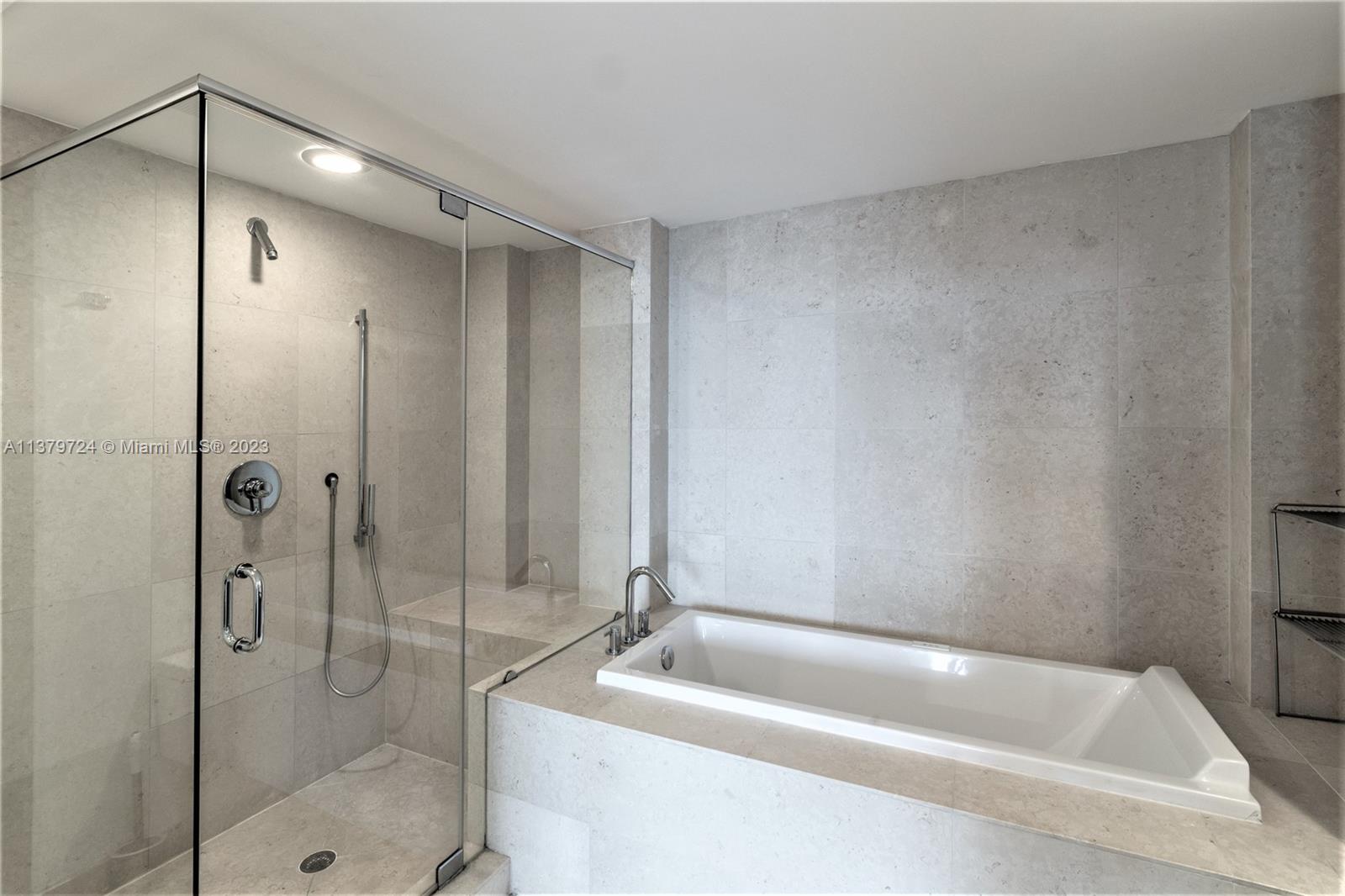 495 Brickell Avenue, Unit 3603 Miami, FL 33131 - Photo 24 of 48 a bathroom with a tub a toilet and a shower