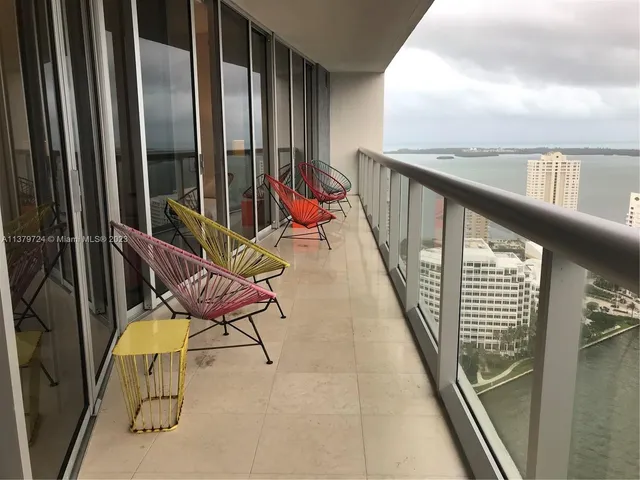 a balcony with chairs