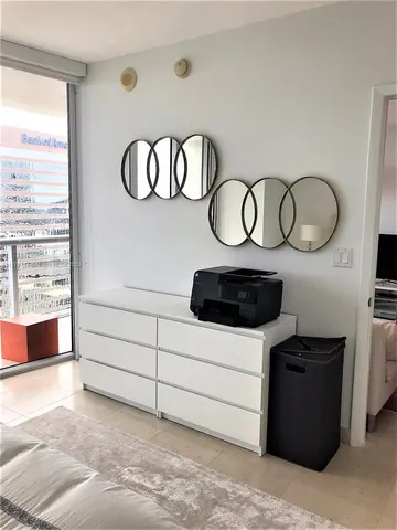 a kitchen with a stove and a white cabinet