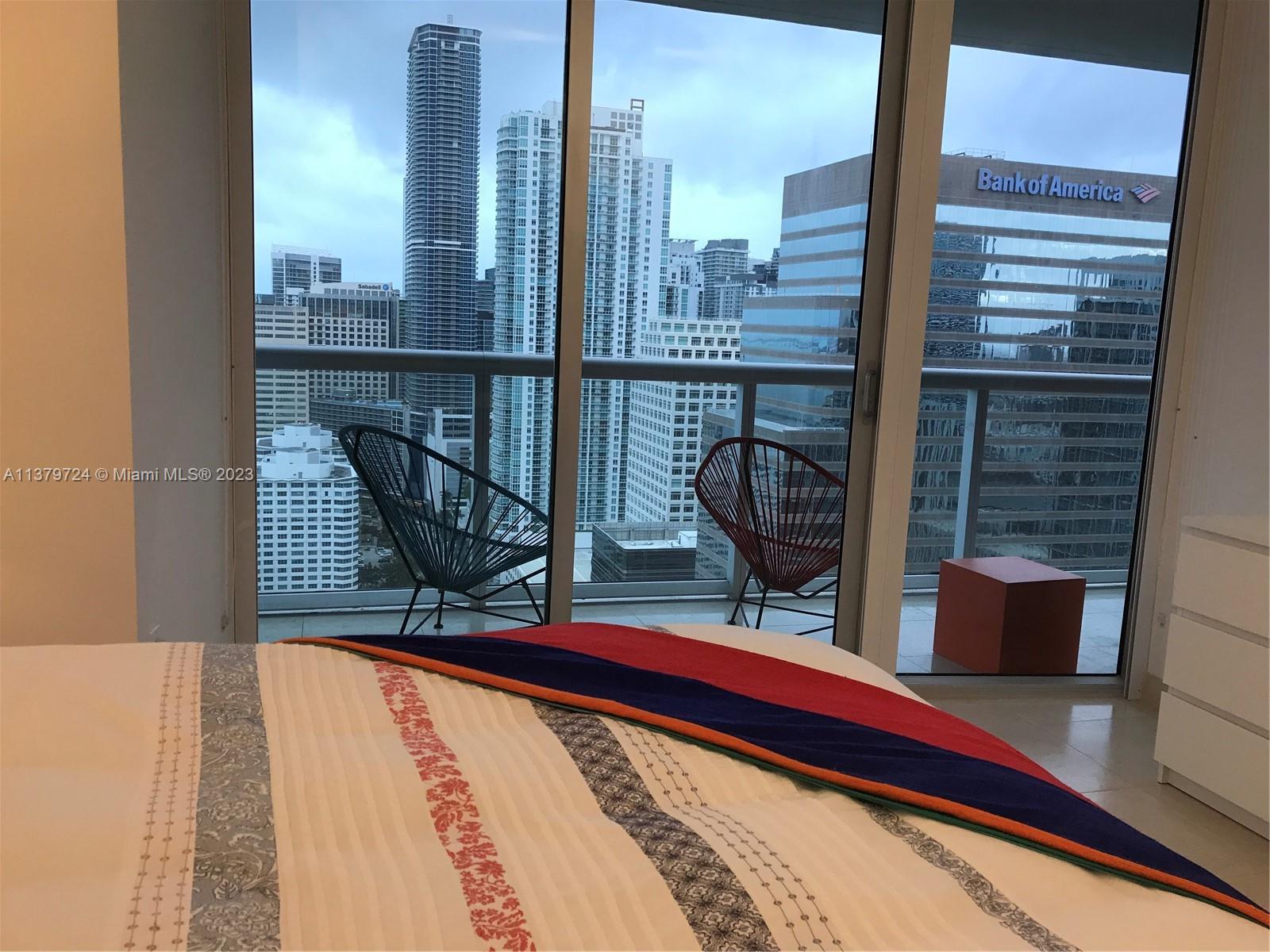 495 Brickell Avenue, Unit 3603 Miami, FL 33131 - Photo 35 of 48 a view of balcony with two chairs and a table