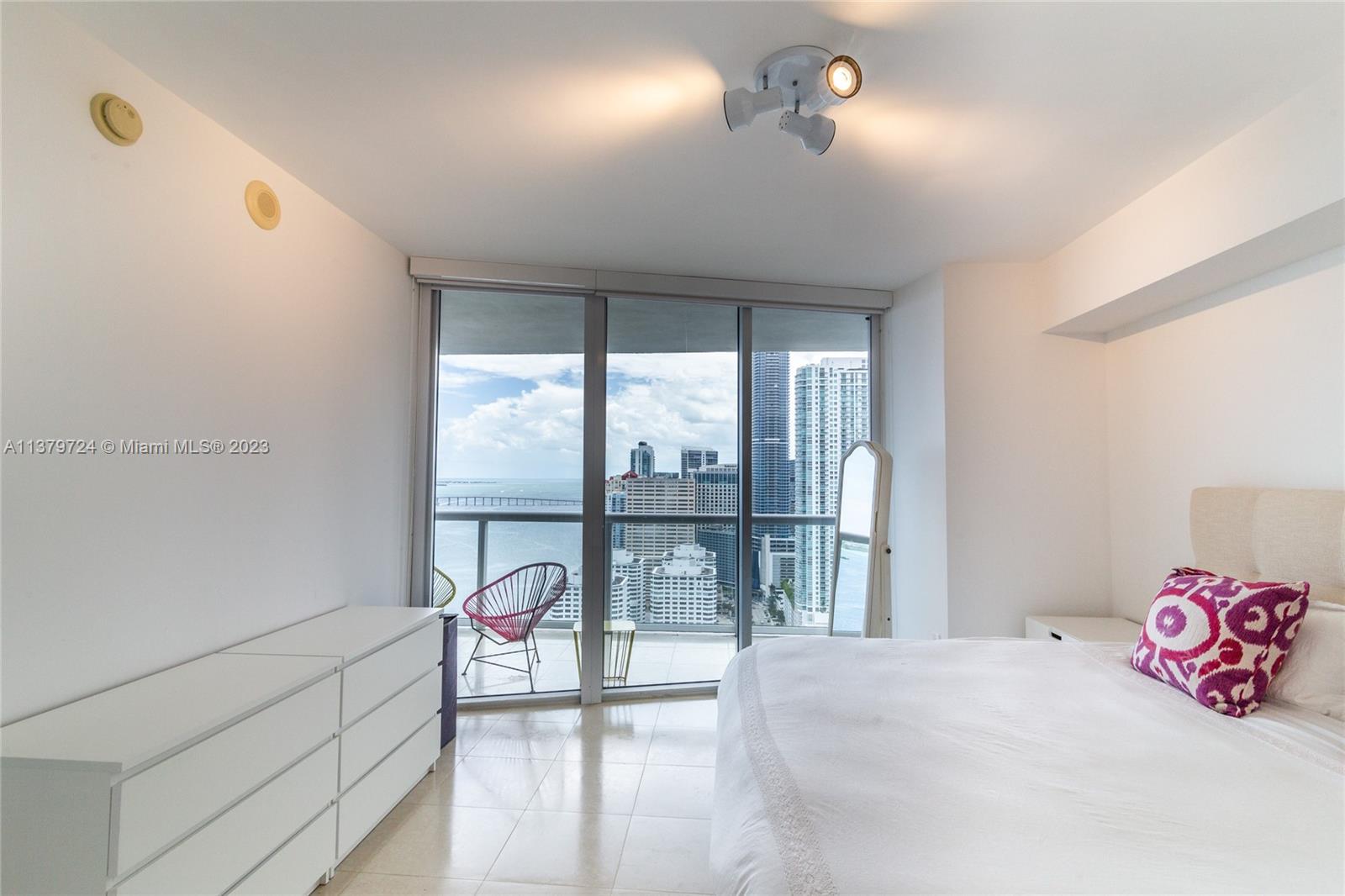 495 Brickell Avenue, Unit 3603 Miami, FL 33131 - Photo 41 of 48 a bedroom with a bed and a large window