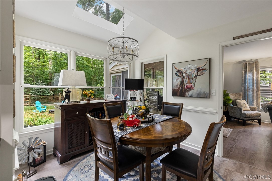5603 Standing Oak Road Midlothian, VA 23112 - Photo 19 of 39 a view of a dining room with furniture window and outside view