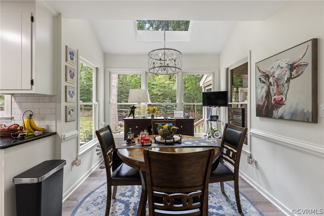 5603 Standing Oak Road Midlothian, VA 23112 - Photo 20 of 39 a view of a dining room with furniture window and outside view