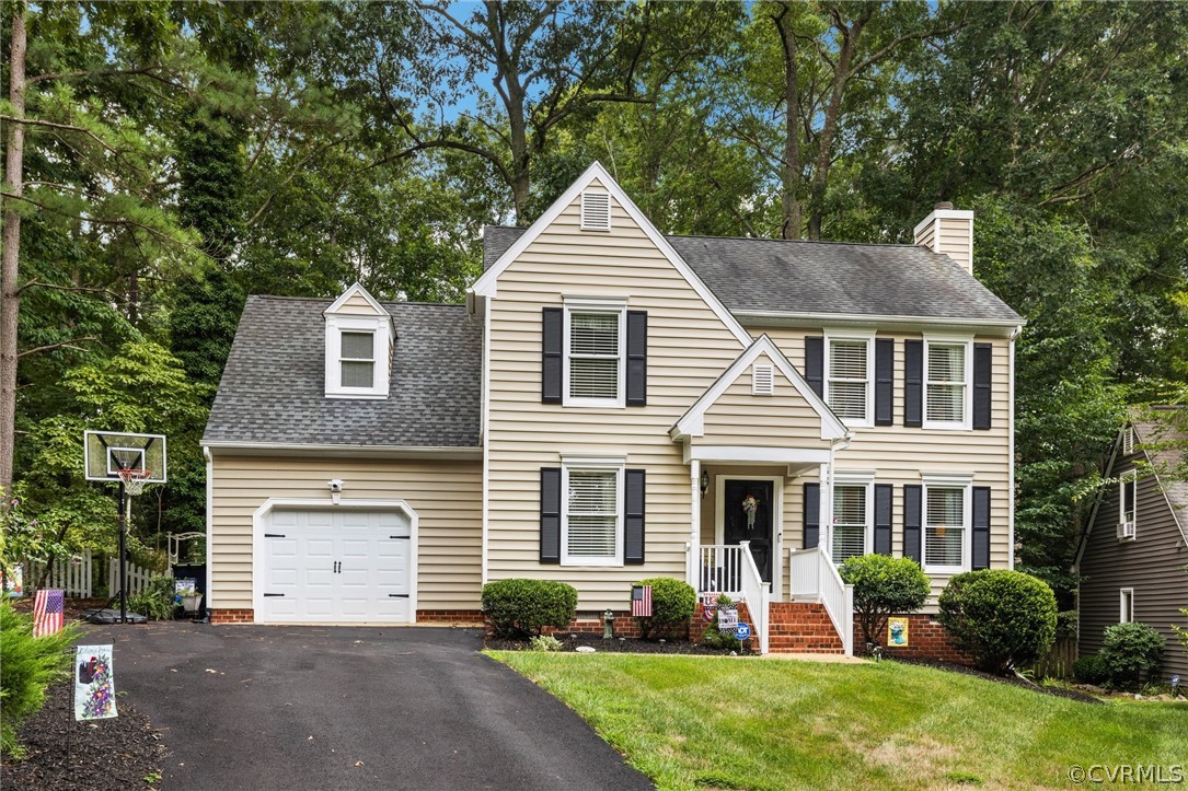 5603 Standing Oak Road Midlothian, VA 23112 - Photo 2 of 39 a front view of a house with a yard and porch