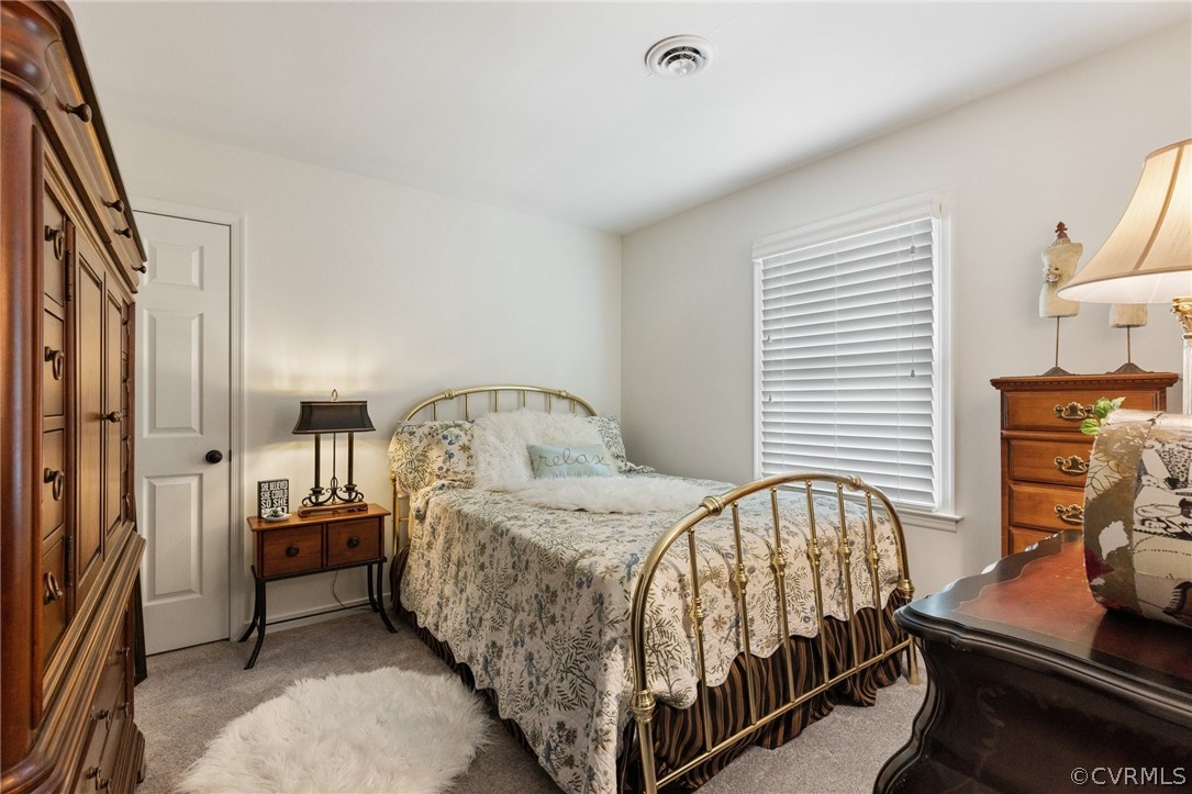 5603 Standing Oak Road Midlothian, VA 23112 - Photo 22 of 39 a bedroom with a bed and a window