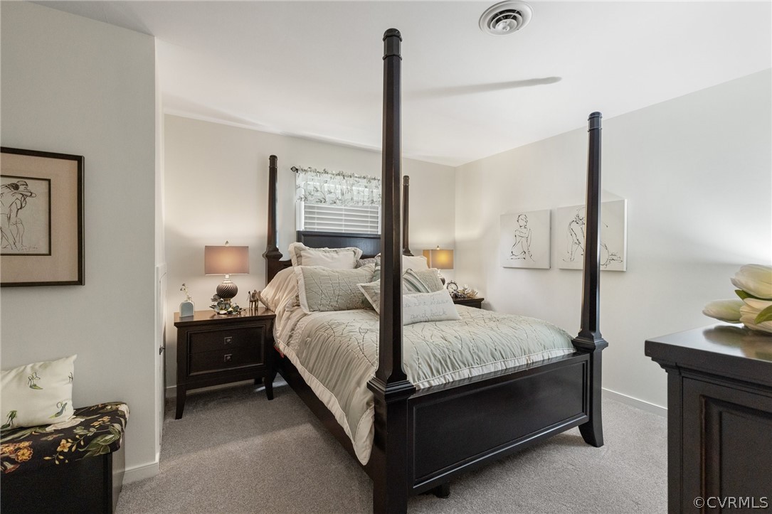 5603 Standing Oak Road Midlothian, VA 23112 - Photo 24 of 39 a bed room with a bed and a night stand