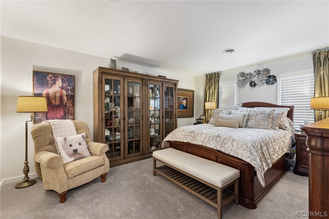 5603 Standing Oak Road Midlothian, VA 23112 - Photo 26 of 39 a spacious bedroom with a bed and lamp