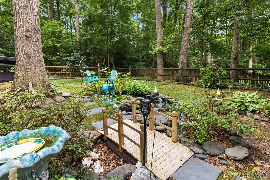 5603 Standing Oak Road Midlothian, VA 23112 - Photo 35 of 39 a garden view with a seating space